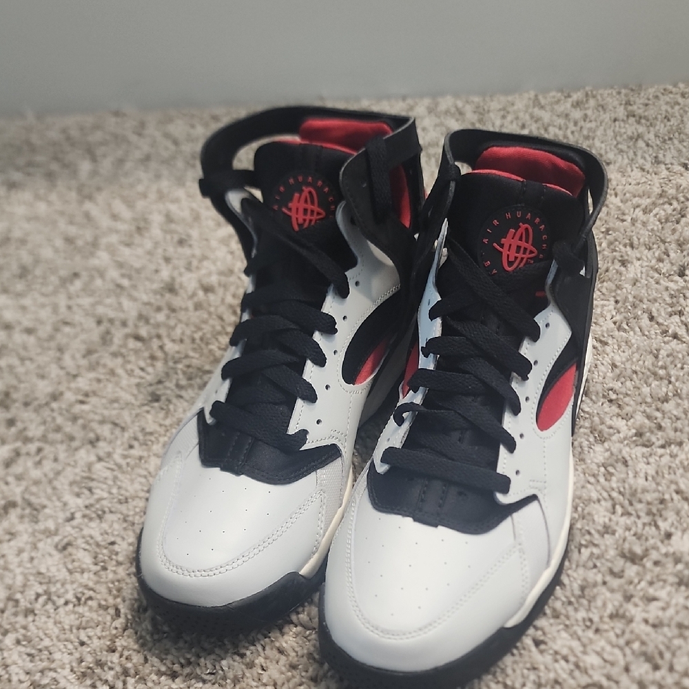 White and Black High-Top Sneakers with Red Accents